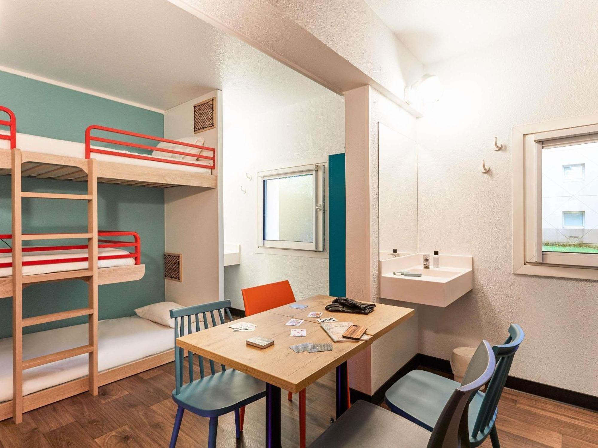 Break Room with Three Single Bunk Beds and Shared Bathroom
